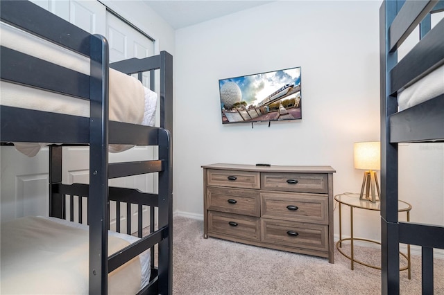 bedroom featuring light colored carpet