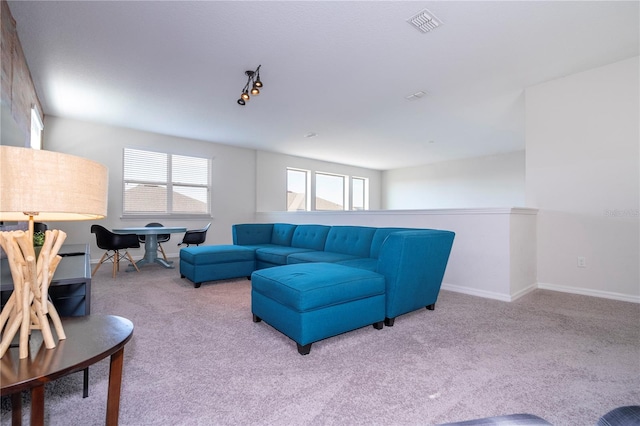 carpeted living room with a wealth of natural light