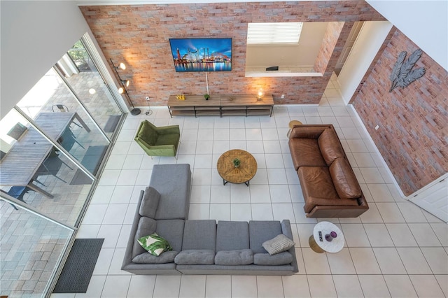 tiled living room with a high ceiling