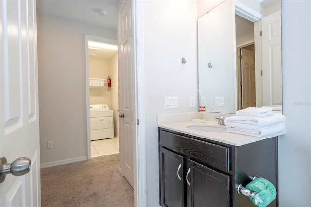 bathroom with washer / clothes dryer, vanity, tile patterned flooring, and a textured ceiling