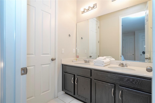 bathroom with tile patterned flooring and vanity