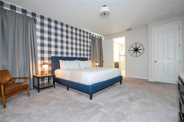 bedroom featuring light colored carpet