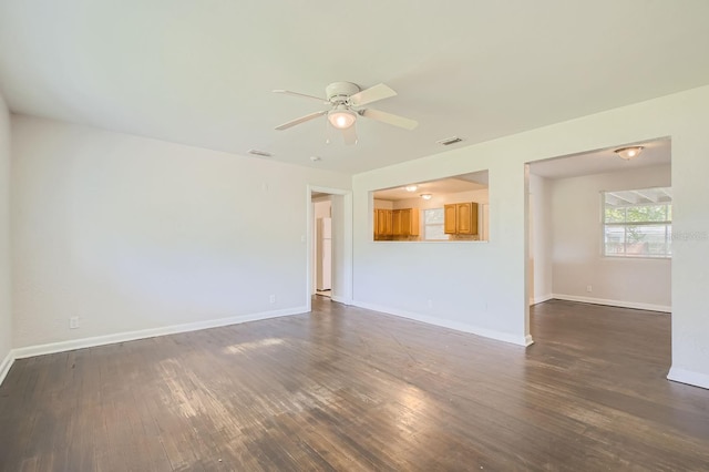 unfurnished living room featuring ceiling fan and hardwood / wood-style floors