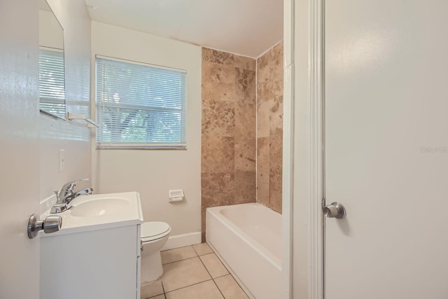 full bathroom with tiled shower / bath, toilet, tile patterned flooring, and vanity