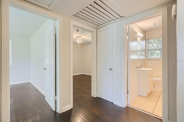 hallway featuring hardwood / wood-style flooring