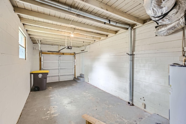 garage featuring a garage door opener and electric water heater