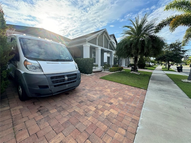 view of property exterior with a lawn