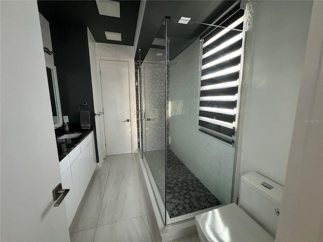 full bath with a shower stall, vanity, toilet, and marble finish floor