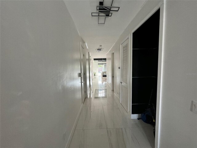 corridor featuring light tile patterned flooring