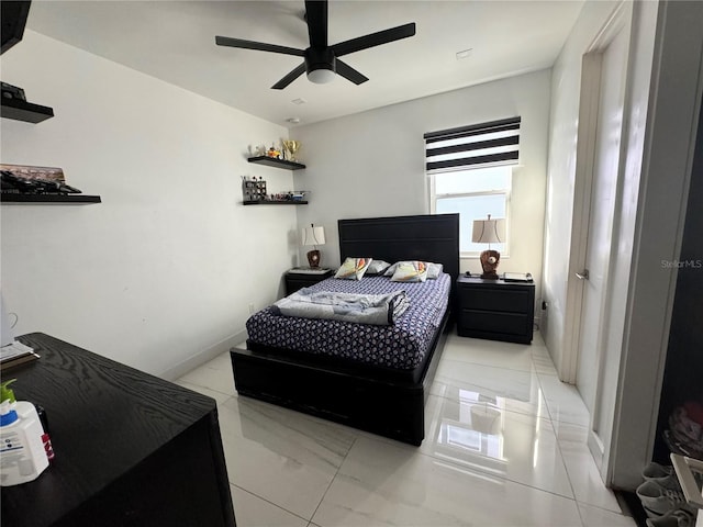 bedroom featuring light tile patterned flooring and ceiling fan