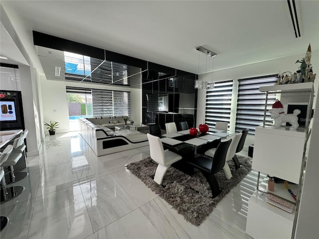 dining space with marble finish floor