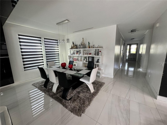 dining area with marble finish floor