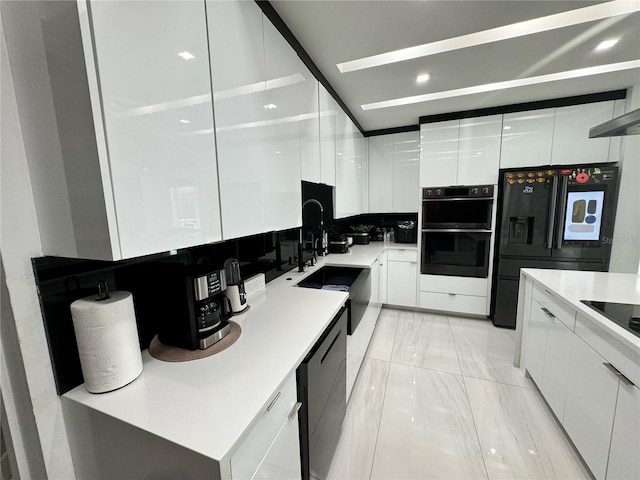 kitchen featuring light tile patterned flooring, white cabinets, and black appliances