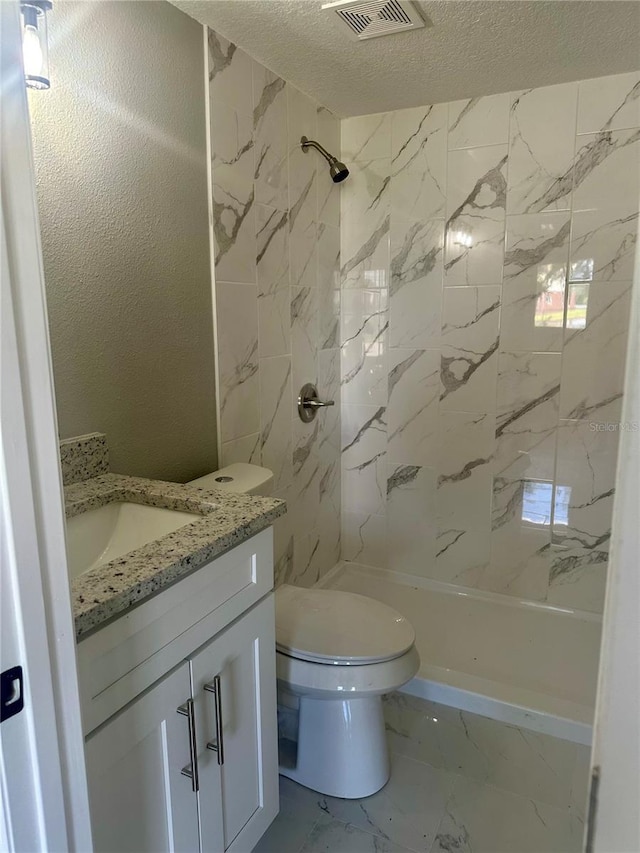 bathroom featuring visible vents, toilet, marble finish floor, walk in shower, and vanity