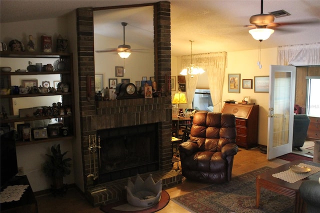 living room featuring vaulted ceiling, brick wall, a fireplace, ceiling fan, and hardwood / wood-style flooring