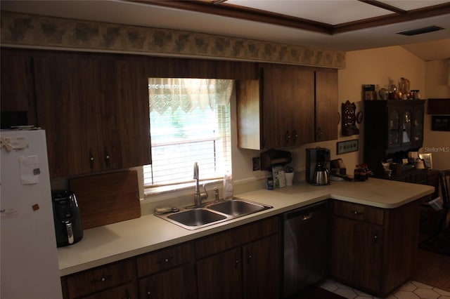 kitchen with dishwasher, dark brown cabinets, sink, kitchen peninsula, and white fridge