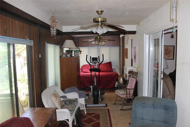 interior space with ceiling fan and tile patterned flooring