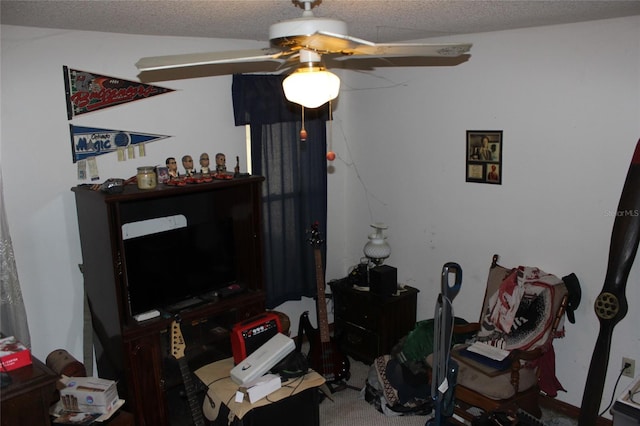 office area with ceiling fan and a textured ceiling