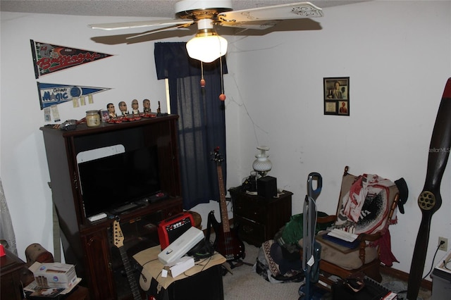 home office with ceiling fan and carpet floors