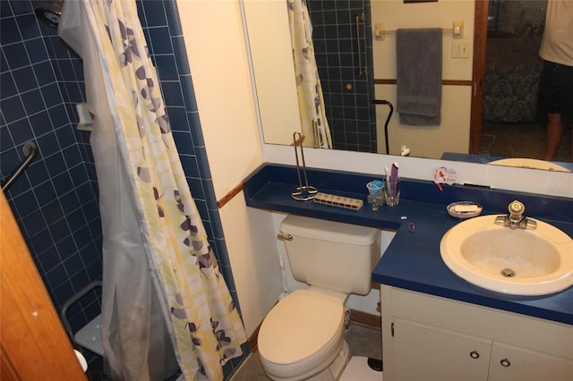 bathroom featuring toilet, vanity, and a shower with curtain