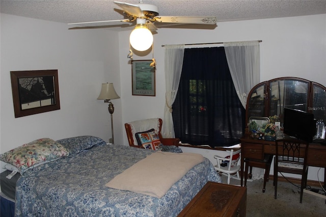 bedroom with a textured ceiling, carpet flooring, and ceiling fan