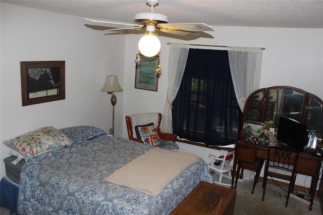 carpeted bedroom featuring a textured ceiling and ceiling fan