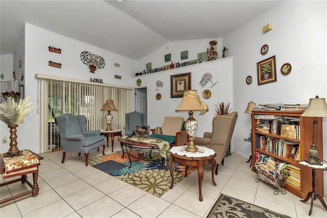 living area featuring light tile patterned floors and vaulted ceiling