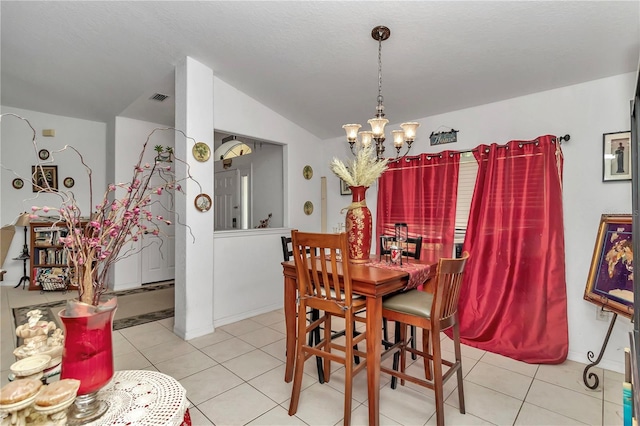 dining area featuring light tile patterned flooring, vaulted ceiling, and an inviting chandelier