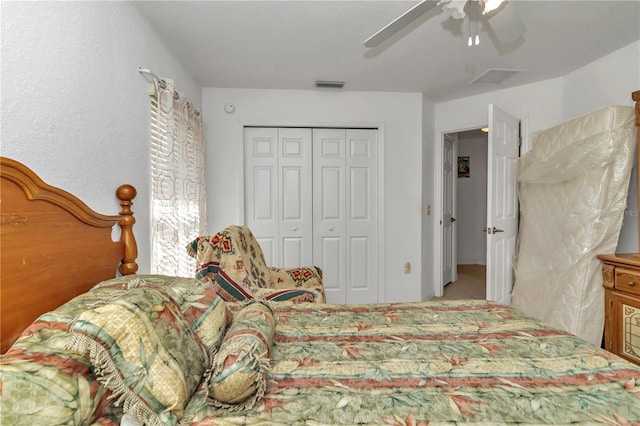 bedroom featuring ceiling fan and a closet