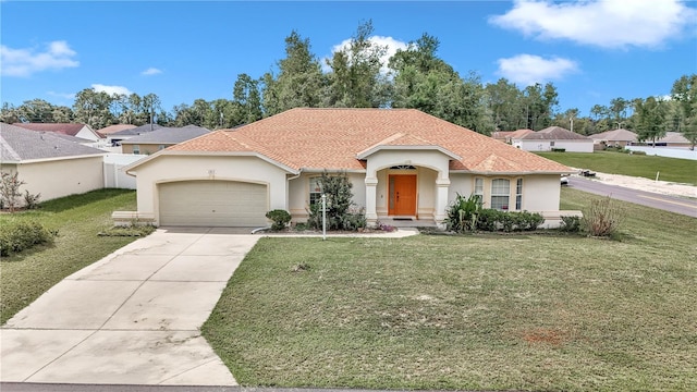 mediterranean / spanish-style house with a front lawn and a garage