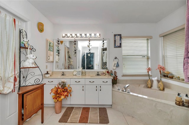 bathroom featuring tile patterned flooring, vanity, and a bathtub