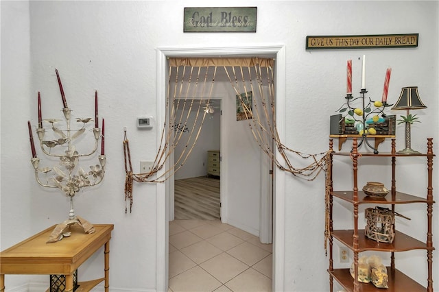 corridor with light tile patterned floors