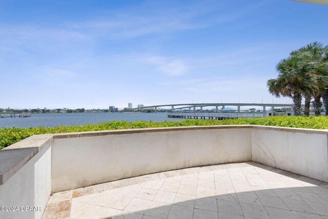 231 Riverside Dr Unit 101-1, Holly Hill, FL 32117 - view of patio with a water view