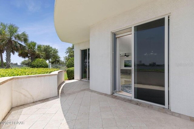 231 Riverside Dr Unit 101-1, Holly Hill, FL 32117 - balcony with a patio