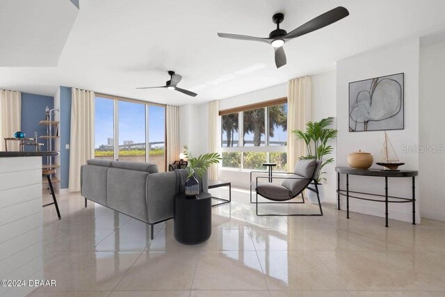 231 Riverside Dr Unit 101-1, Holly Hill, FL 32117 - tiled living room featuring a ceiling fan and baseboards