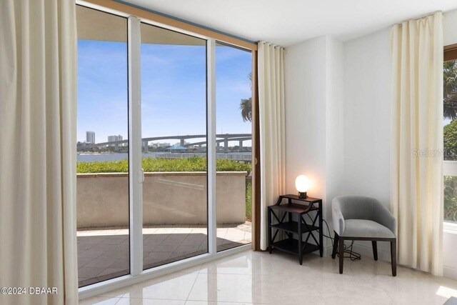 231 Riverside Dr Unit 101-1, Holly Hill, FL 32117 - entryway with healthy amount of natural light and tile patterned floors