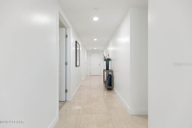 231 Riverside Dr Unit 101-1, Holly Hill, FL 32117 - hallway featuring recessed lighting, baseboards, and light tile patterned flooring