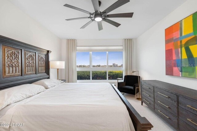 231 Riverside Dr Unit 101-1, Holly Hill, FL 32117 - bedroom featuring light colored carpet and ceiling fan