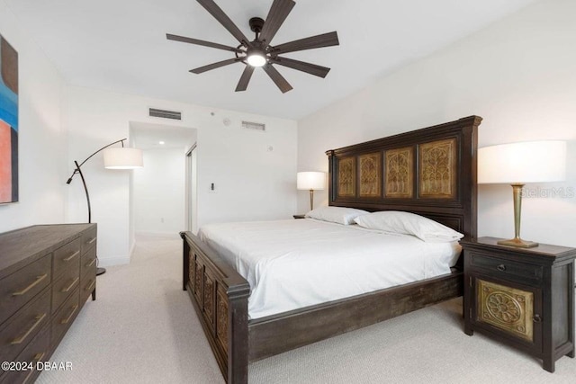 231 Riverside Dr Unit 101-1, Holly Hill, FL 32117 - bedroom with light carpet and ceiling fan
