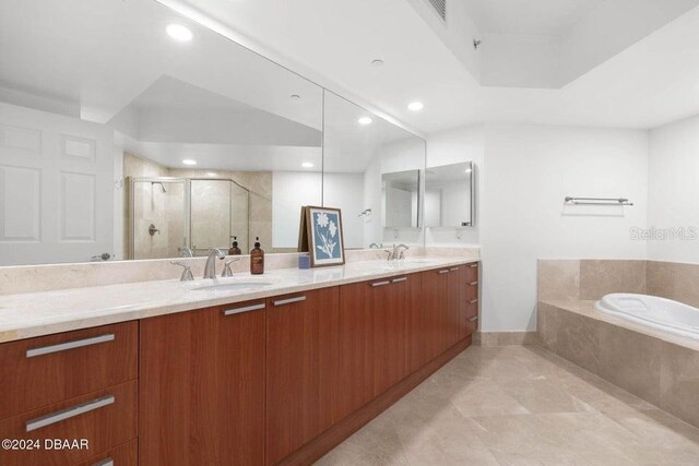 231 Riverside Dr Unit 101-1, Holly Hill, FL 32117 - full bath with a shower stall, double vanity, a garden tub, and recessed lighting