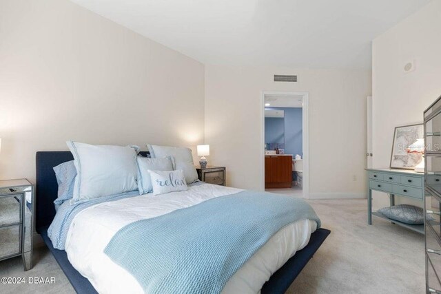 231 Riverside Dr Unit 101-1, Holly Hill, FL 32117 - bedroom with carpet and baseboards
