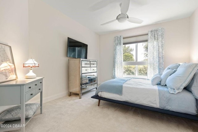 231 Riverside Dr Unit 101-1, Holly Hill, FL 32117 - bedroom featuring light colored carpet, baseboards, and ceiling fan