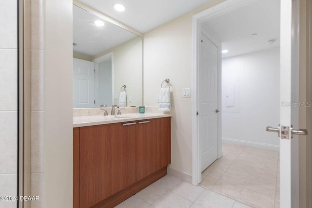 231 Riverside Dr Unit 101-1, Holly Hill, FL 32117 - bathroom featuring tile patterned floors, vanity, baseboards, and recessed lighting