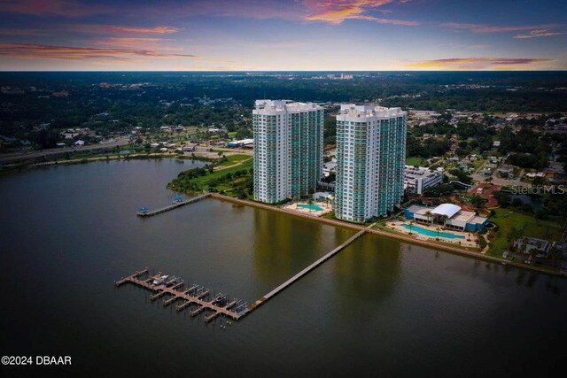 231 Riverside Dr Unit 101-1, Holly Hill, FL 32117 - aerial view at dusk of a water view and a city view