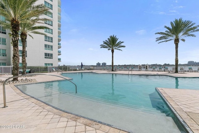 231 Riverside Dr Unit 101-1, Holly Hill, FL 32117 - community pool featuring fence and a patio