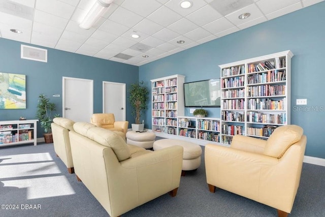 231 Riverside Dr Unit 101-1, Holly Hill, FL 32117 - living room featuring carpet flooring, a paneled ceiling, baseboards, and recessed lighting