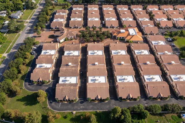 birds eye view of property with a residential view