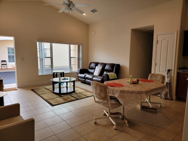 dining space featuring ceiling fan, high vaulted ceiling, and light tile patterned flooring