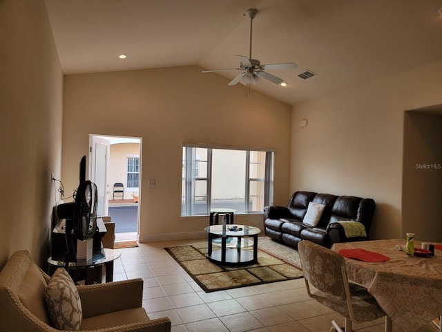 living room featuring ceiling fan, high vaulted ceiling, light tile patterned flooring, and visible vents