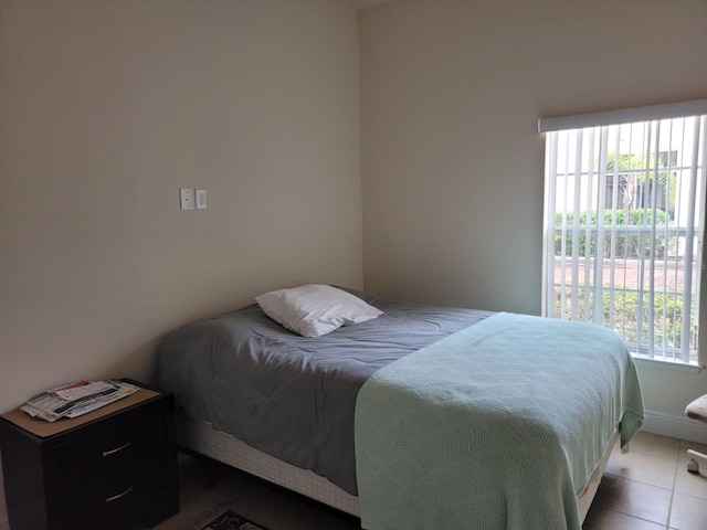 bedroom with light tile patterned flooring